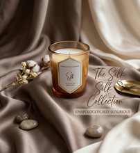 Load image into Gallery viewer, Selfish Scents Silk 8oz coconut apricot wax candle in warm amber glass jar